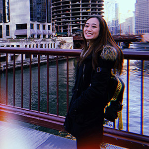 Kim smiling on a bridge in Chicago