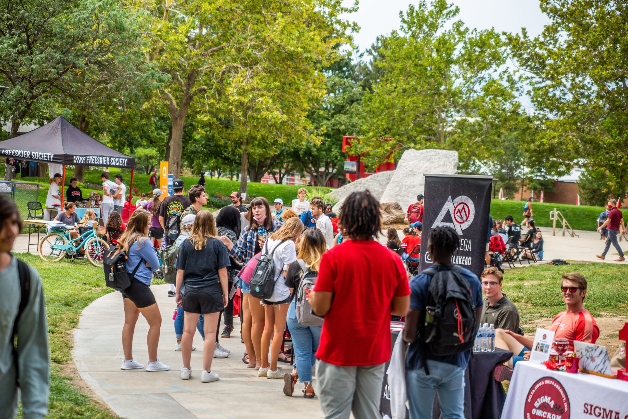 a crowd of students at a fair learning about student groups on campus
