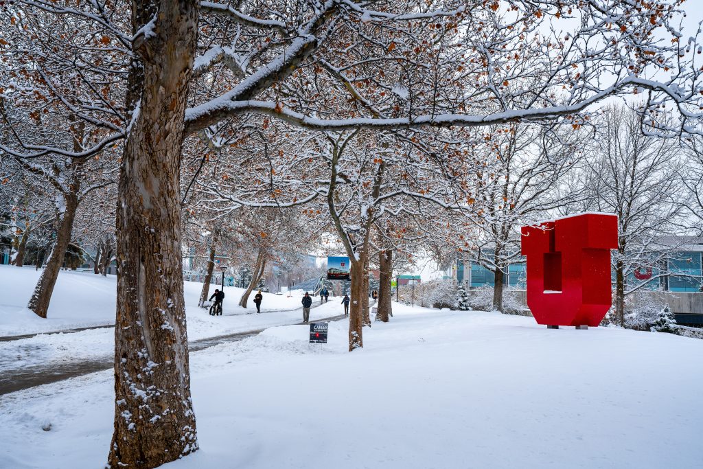 the large Block U installation on the University of Utah campus covered in snow