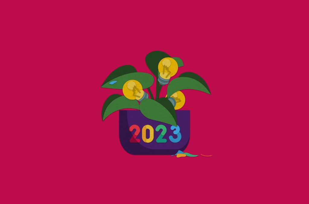 cut and arranged paper to resemble a potted plant blooming light bulbs. the pot has the text '2023' on the front